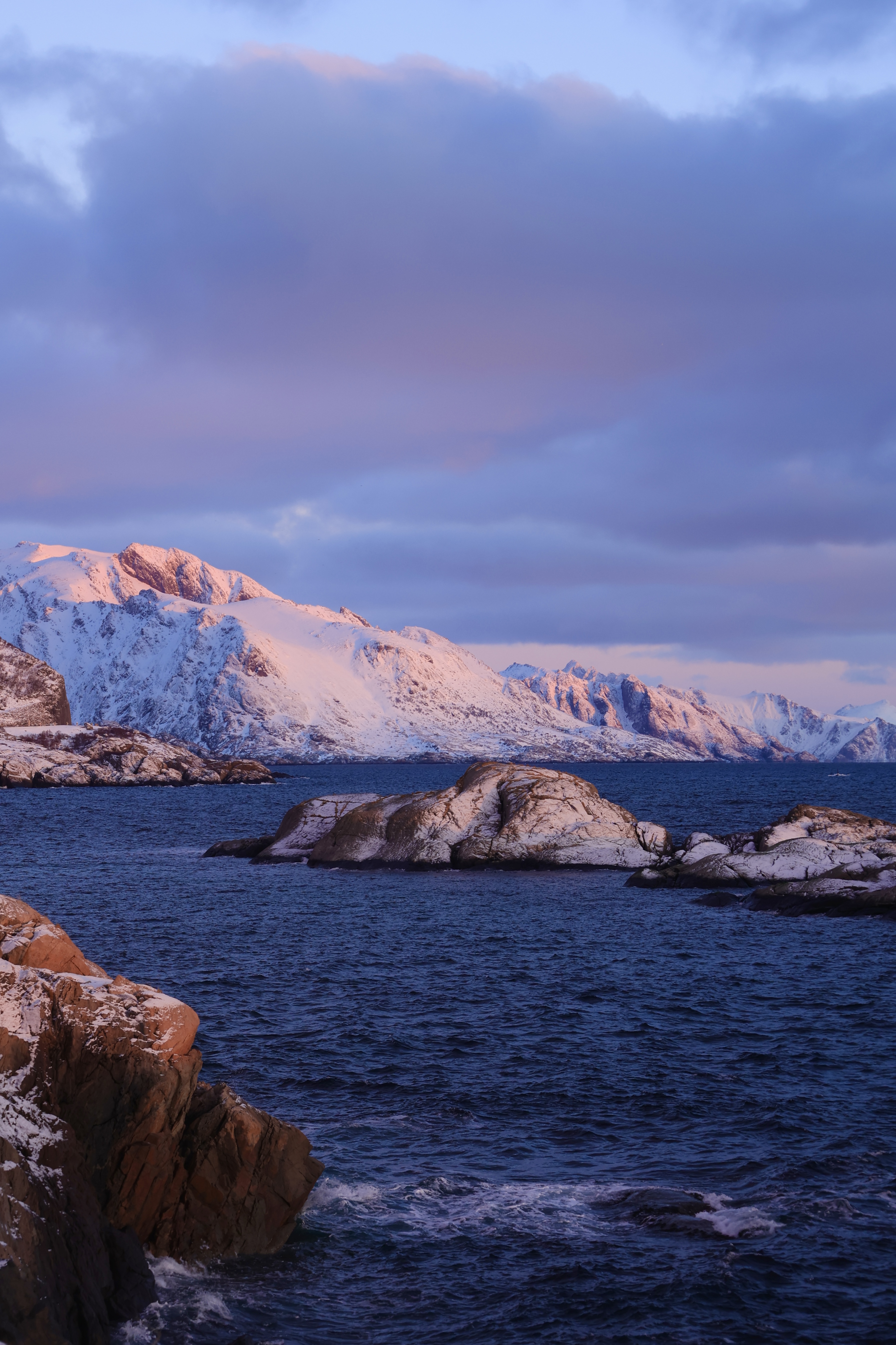 Pink snowy mountain in the first sunlight, Reine
